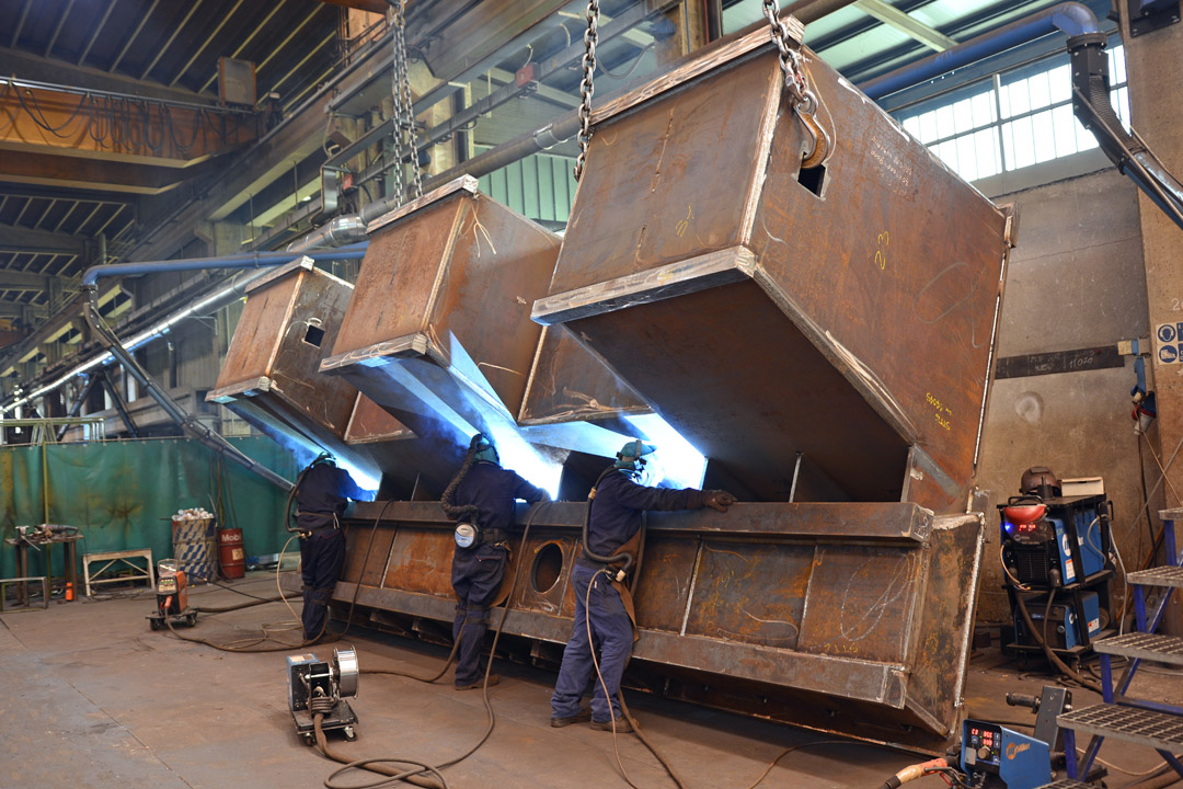 Delma welding department working on a heavy steel structure